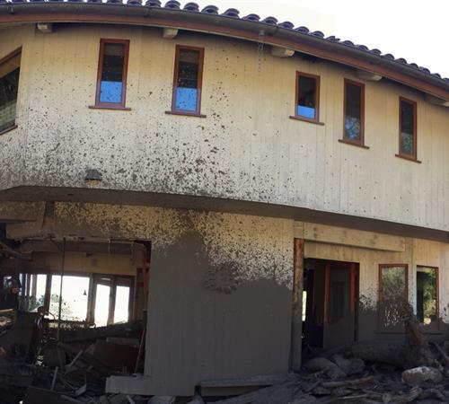 House damaged by debris flow